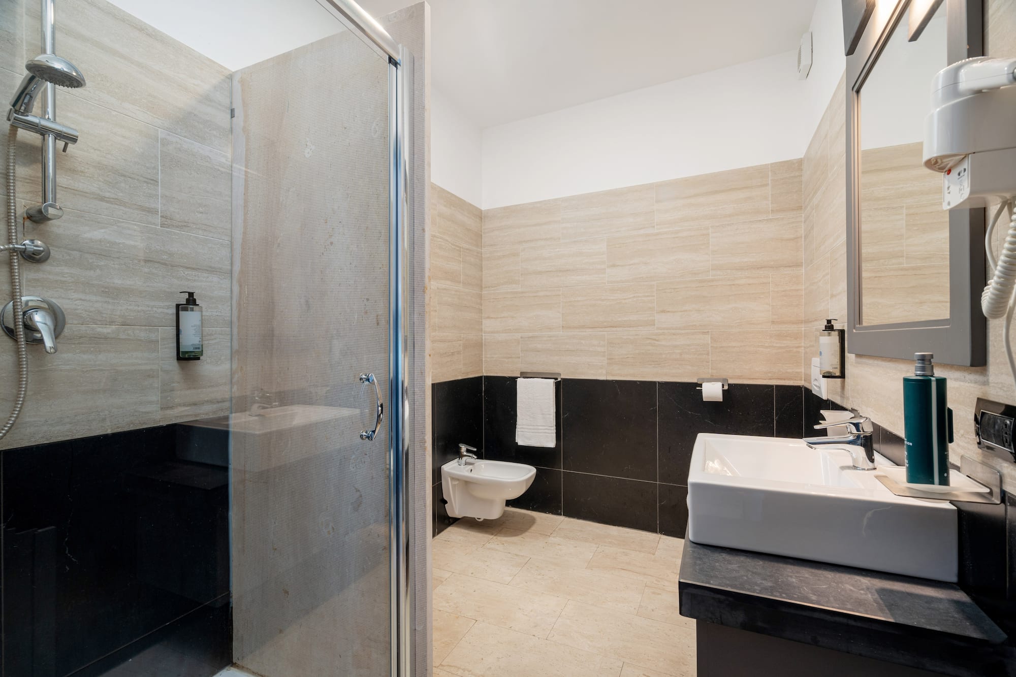 a bathroom with a shower and sink