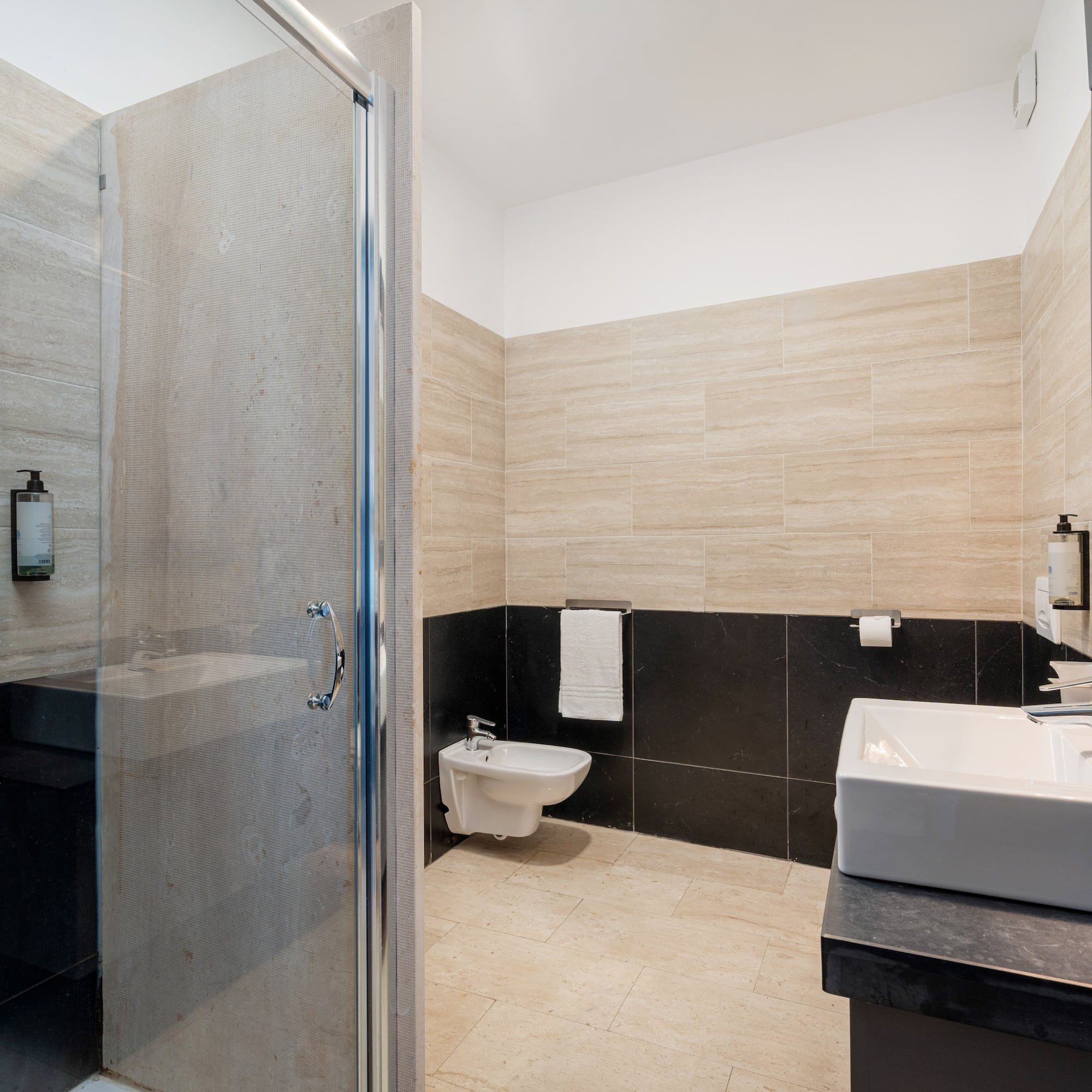 a bathroom with a shower and sink