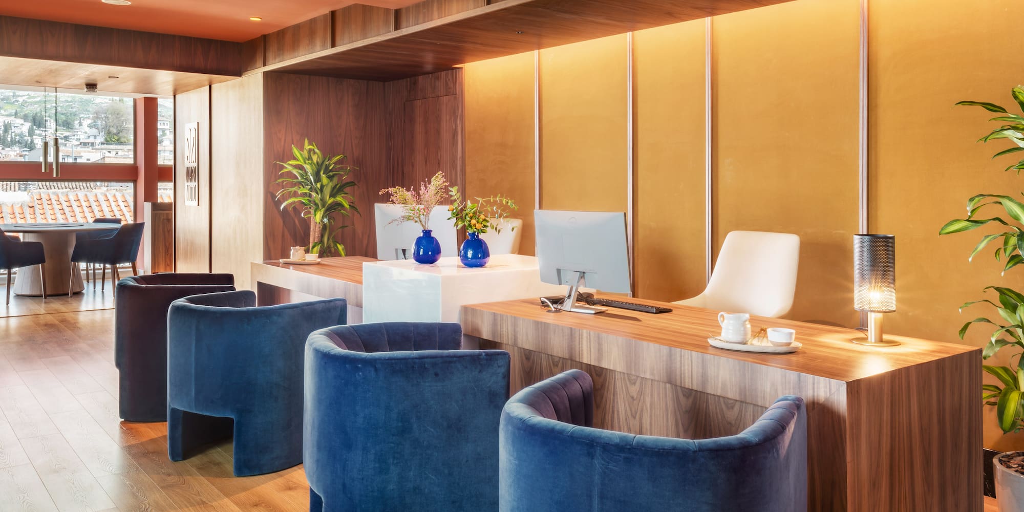 a room with blue chairs and a computer