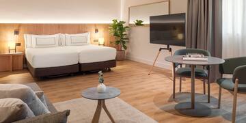 a room with a bed and a tv