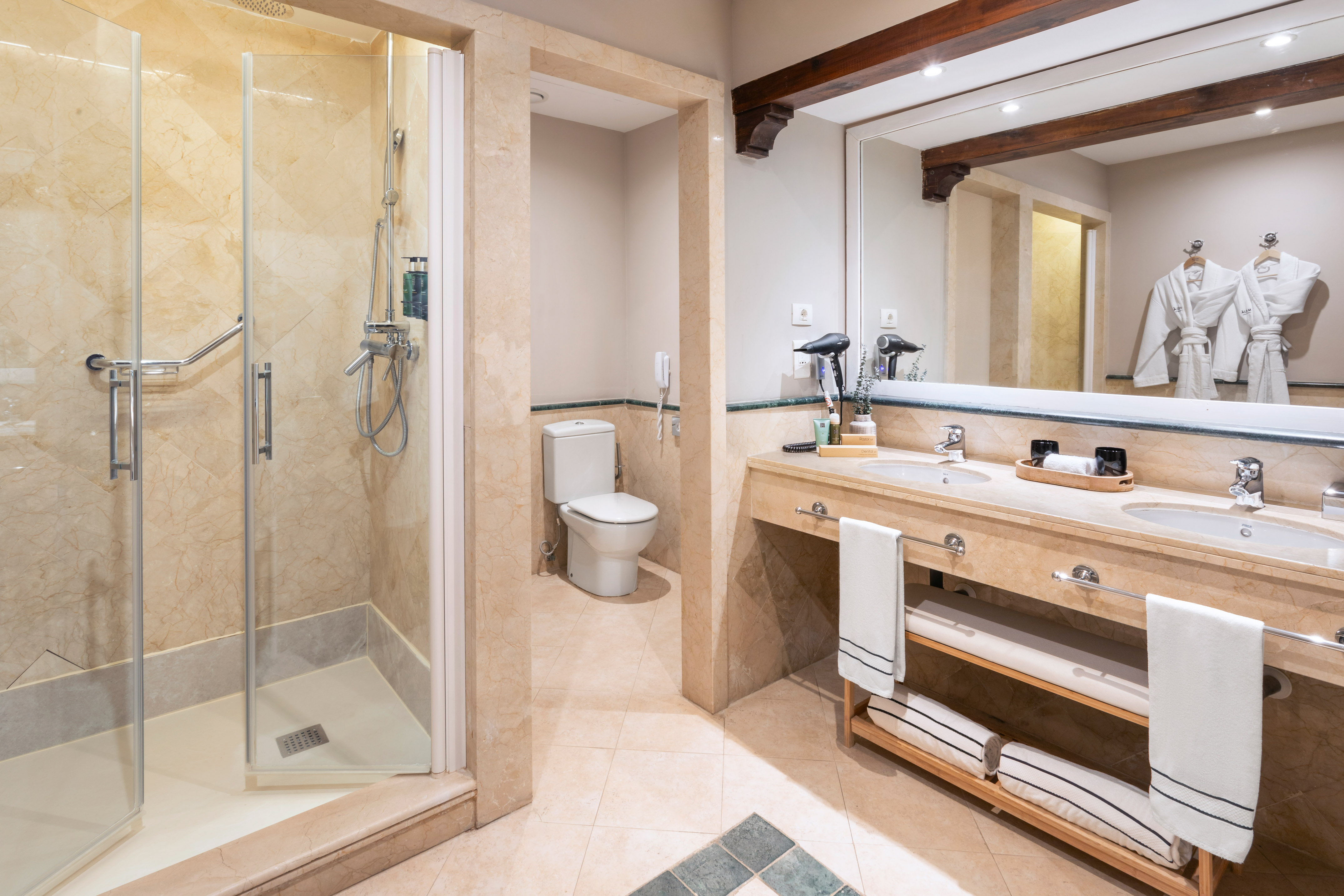 a bathroom with a shower and sink