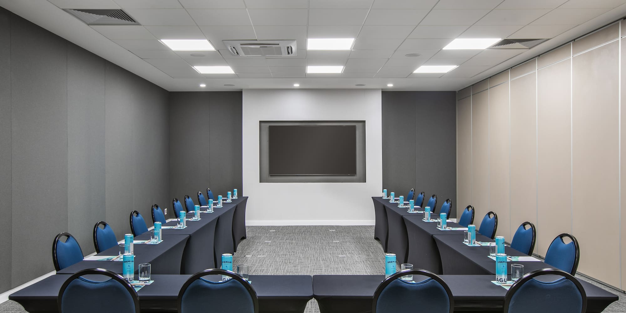 a room with a long table and chairs