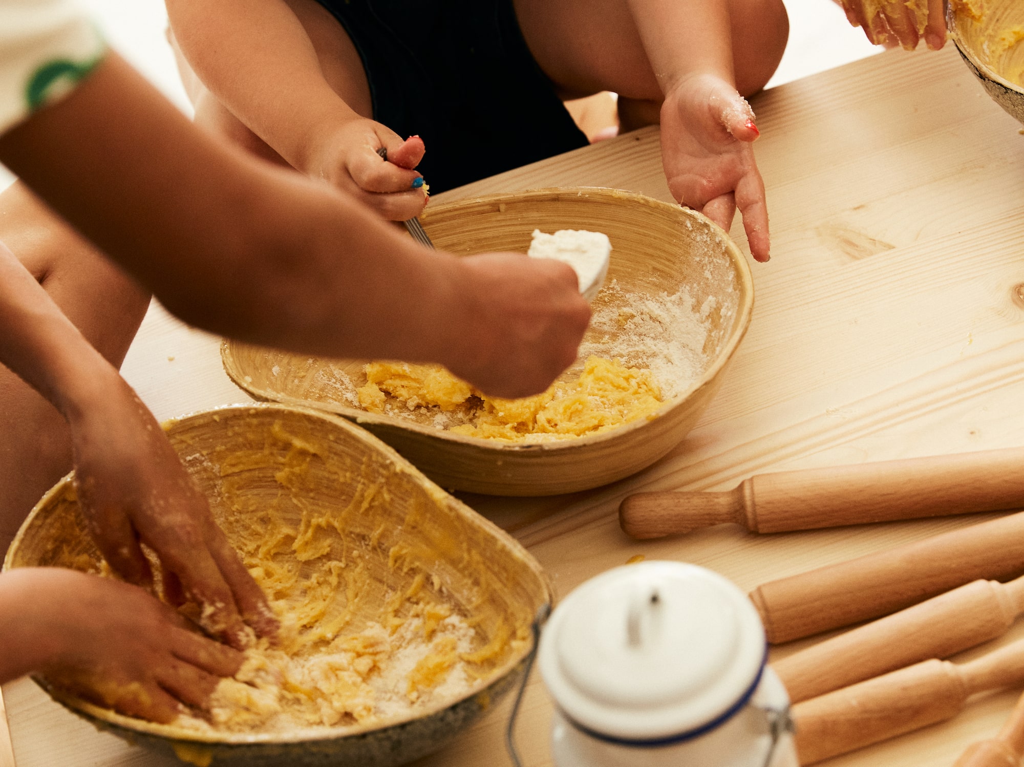 a group of people making dough