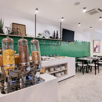 a room with a variety of cereals and a green wall