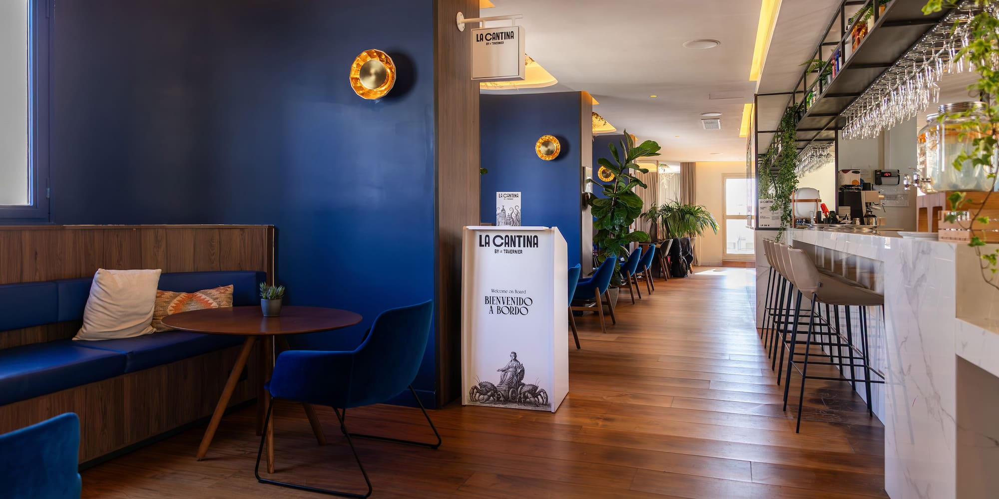 a room with blue walls and tables and chairs