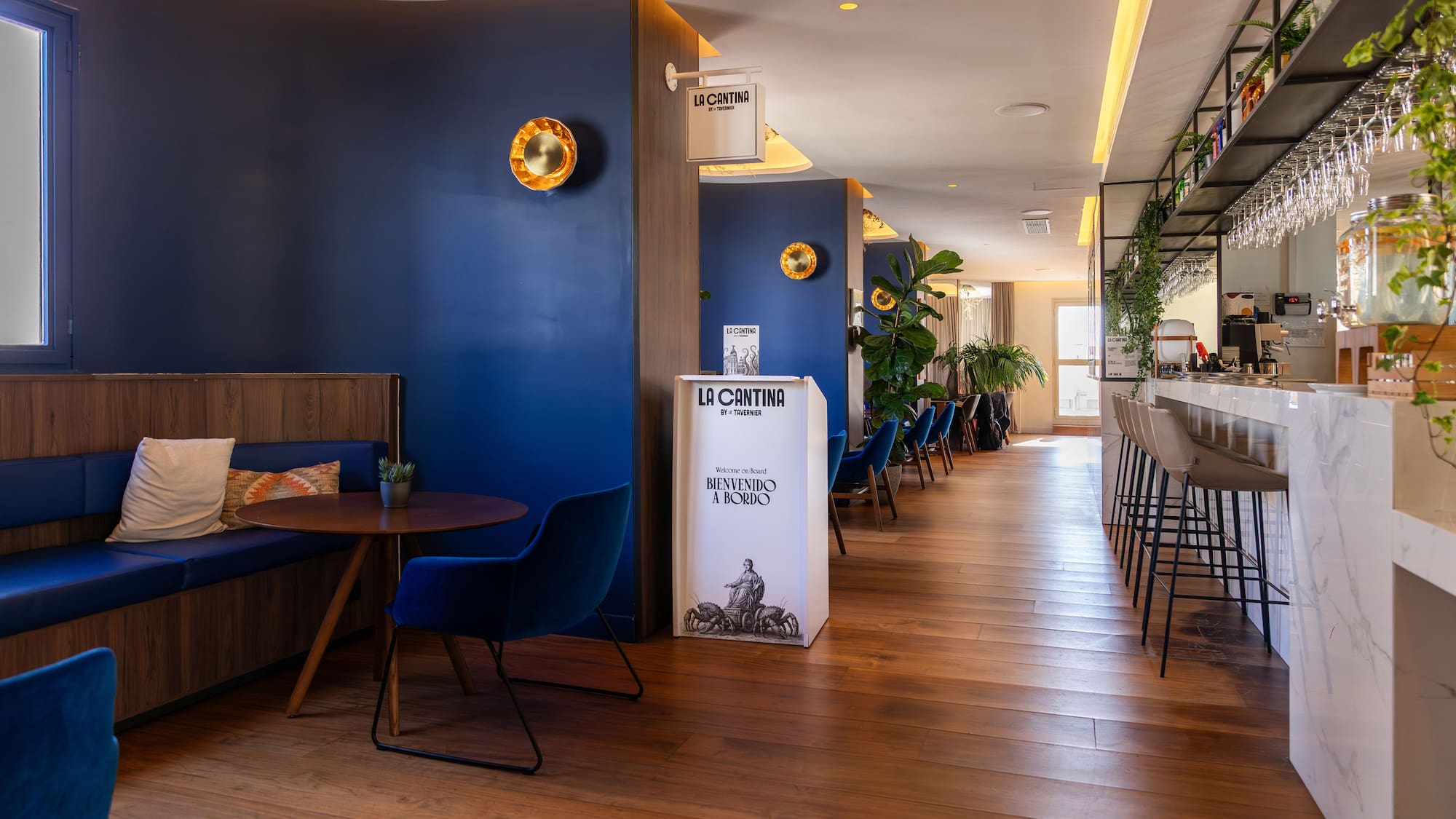 a room with blue walls and tables and chairs