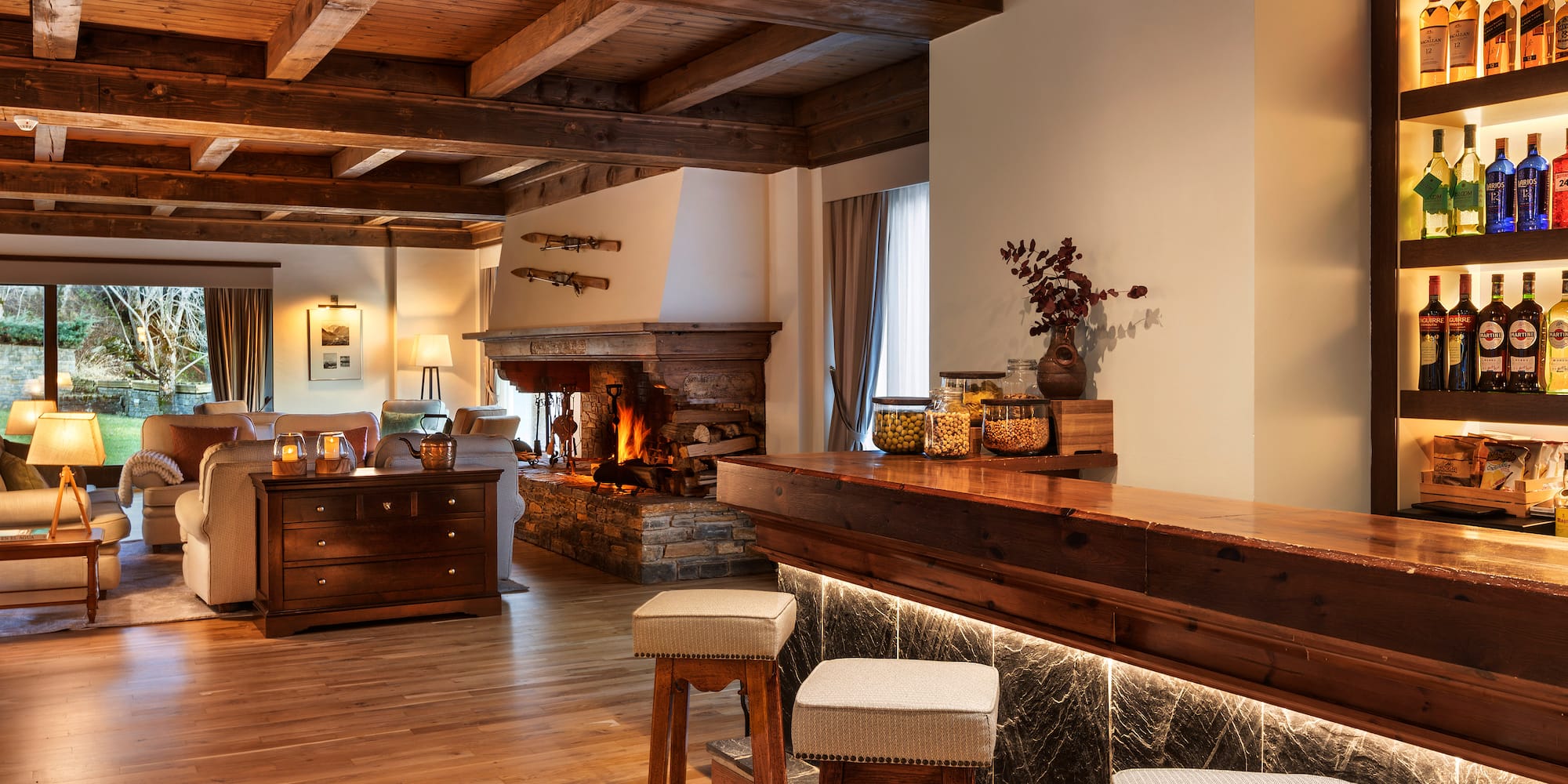 a room with a bar and a fireplace