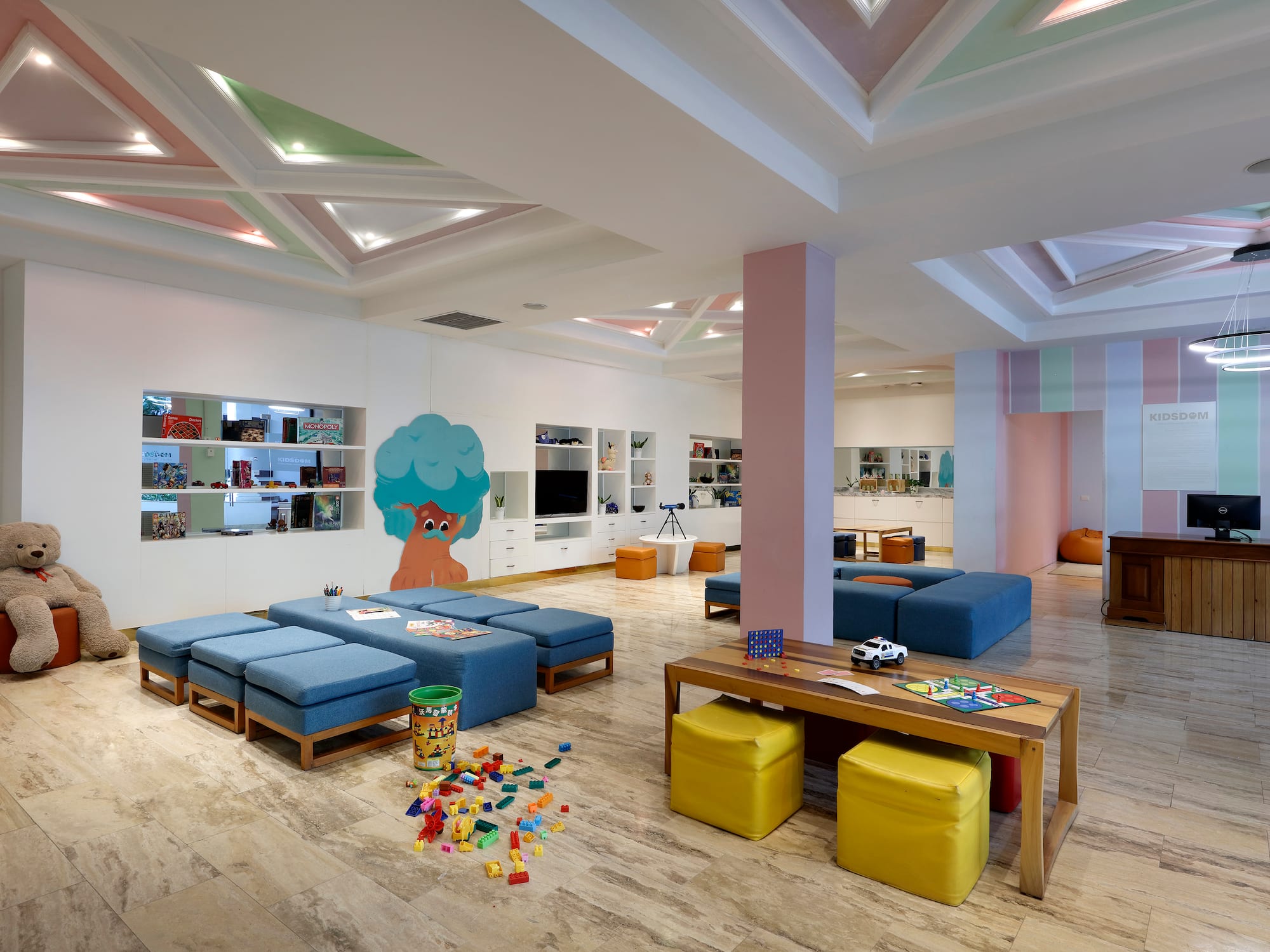 a room with a large table and benches