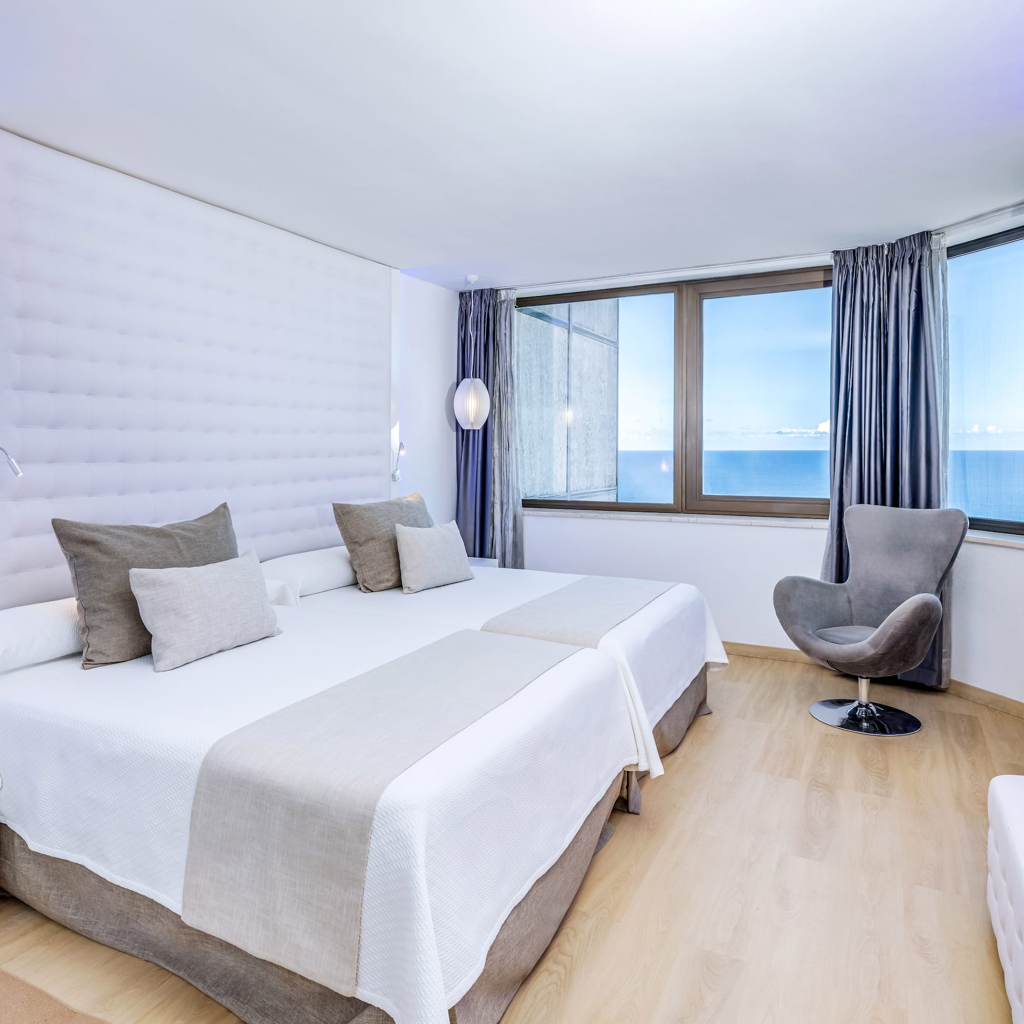 a room with a bed and a chair