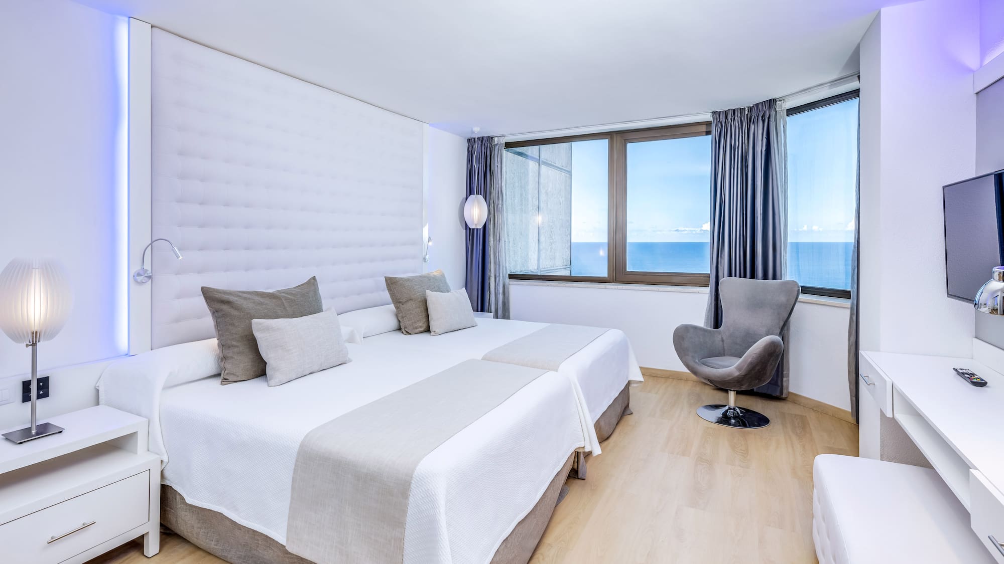 a room with a bed and a chair