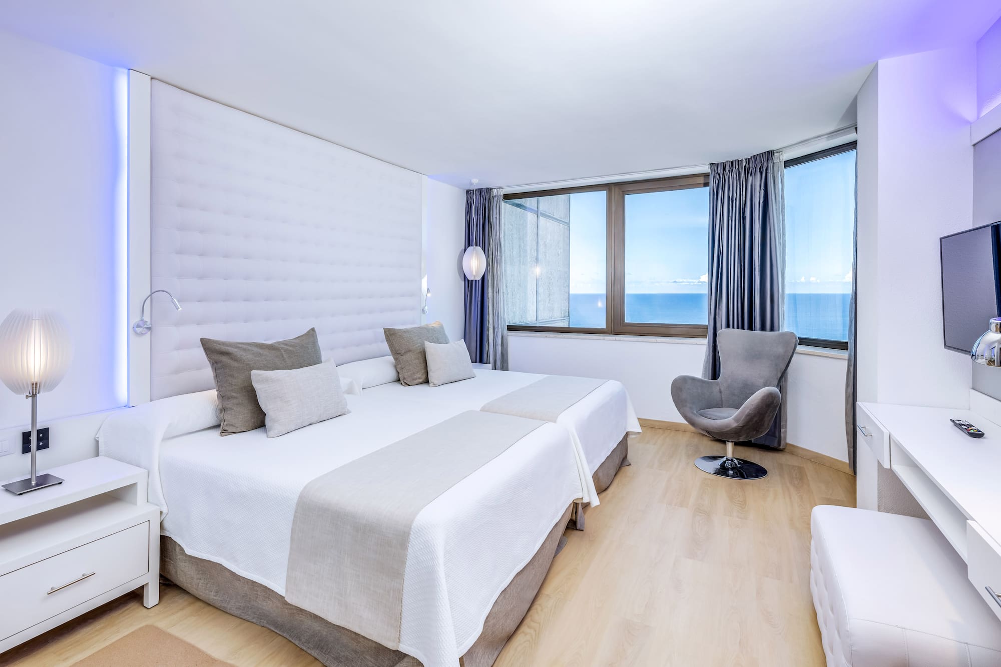 a room with a bed and a chair