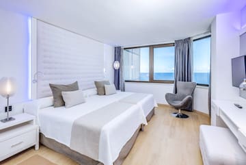 a room with a bed and a chair