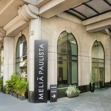 a building with arched windows and a sign