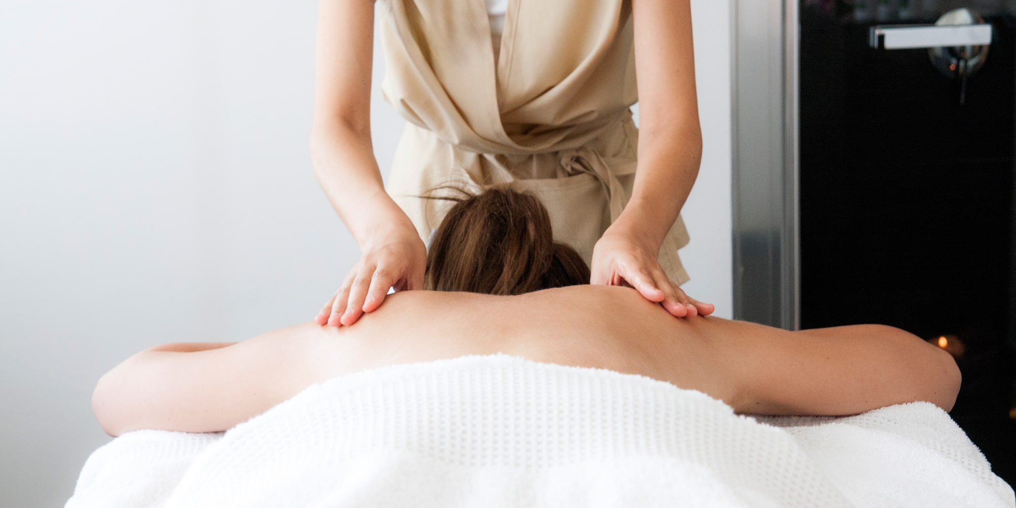 a woman receiving a back massage