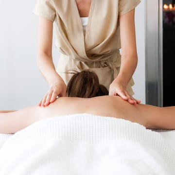 a woman receiving a back massage