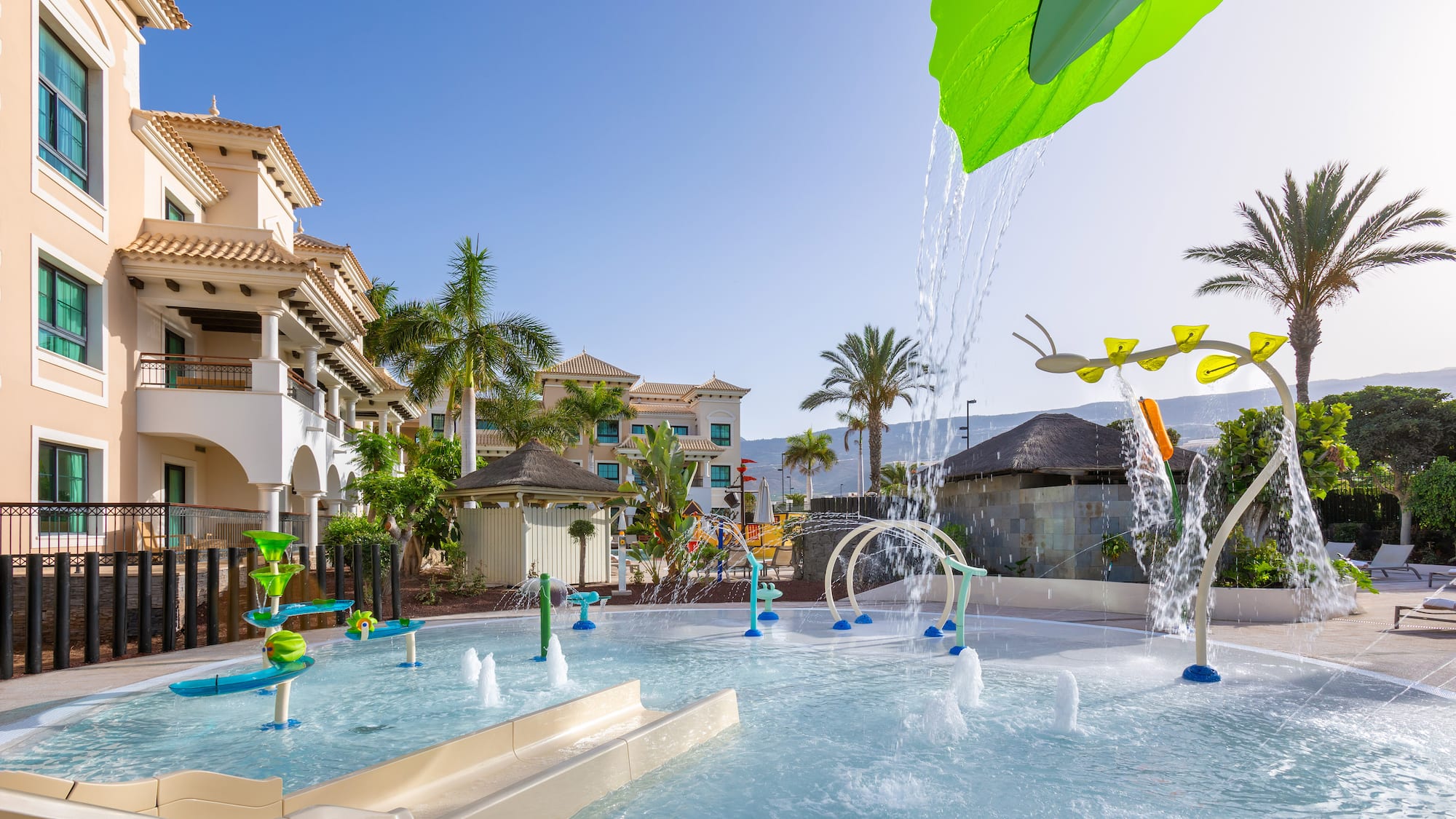 a water park with a slide and a water slide