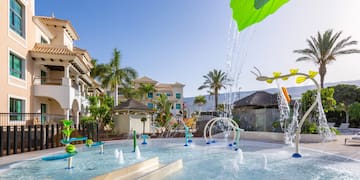 a water park with a slide and a water slide