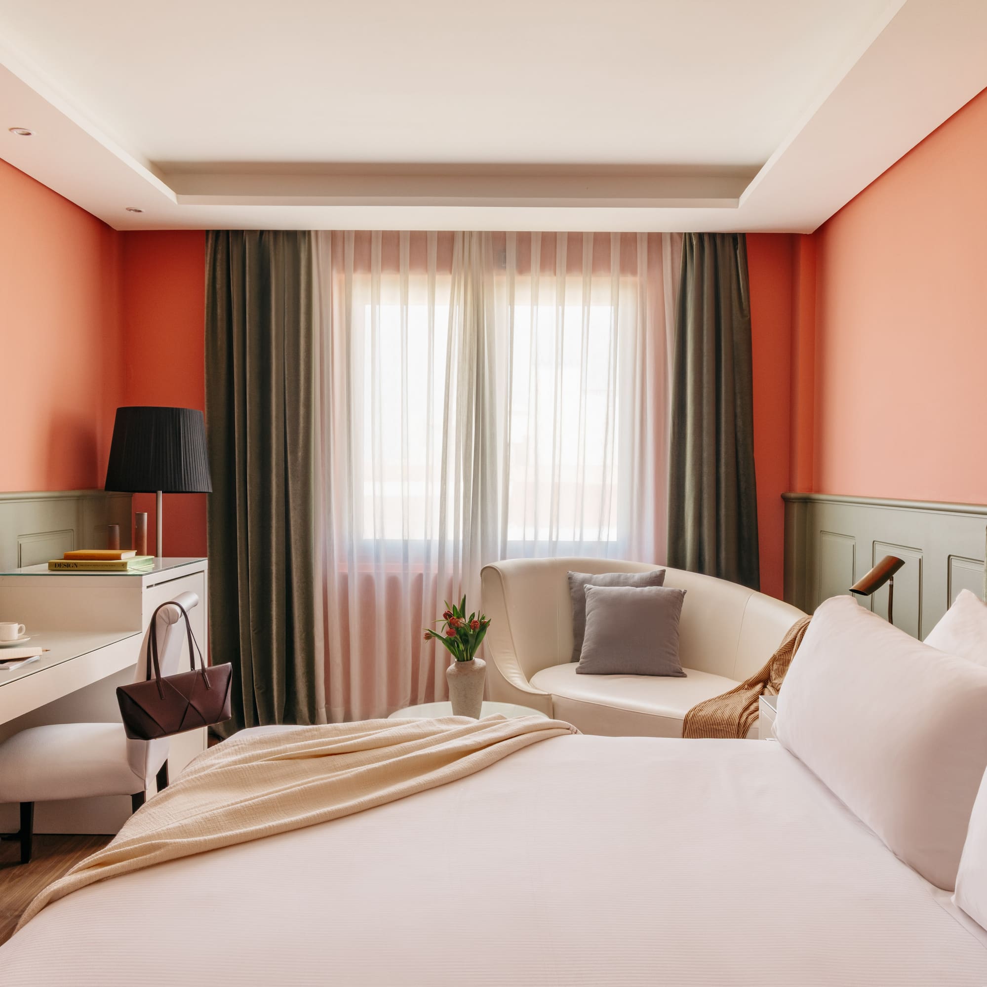 a bedroom with a bed and a chair