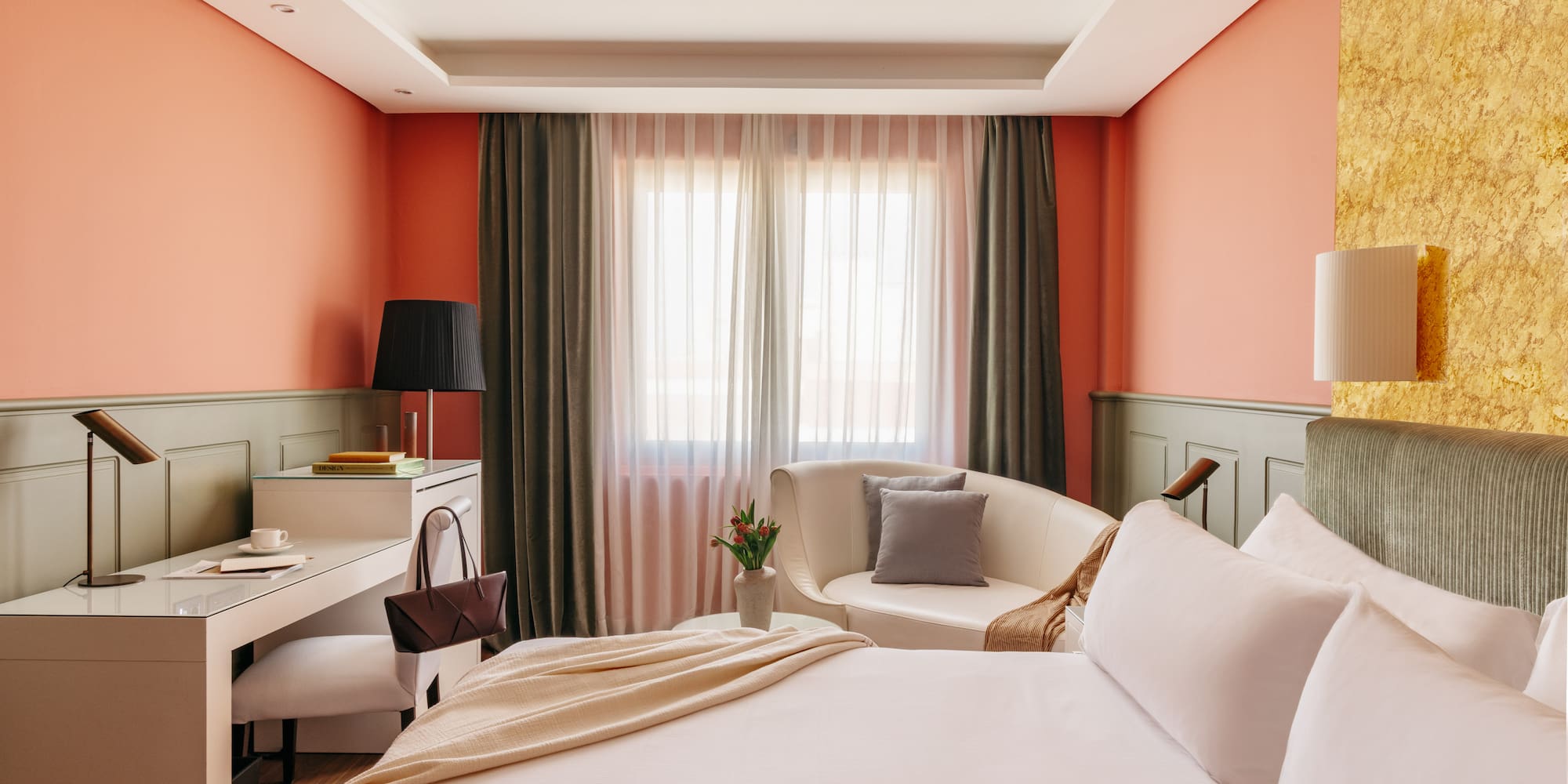 a bedroom with a bed and a chair