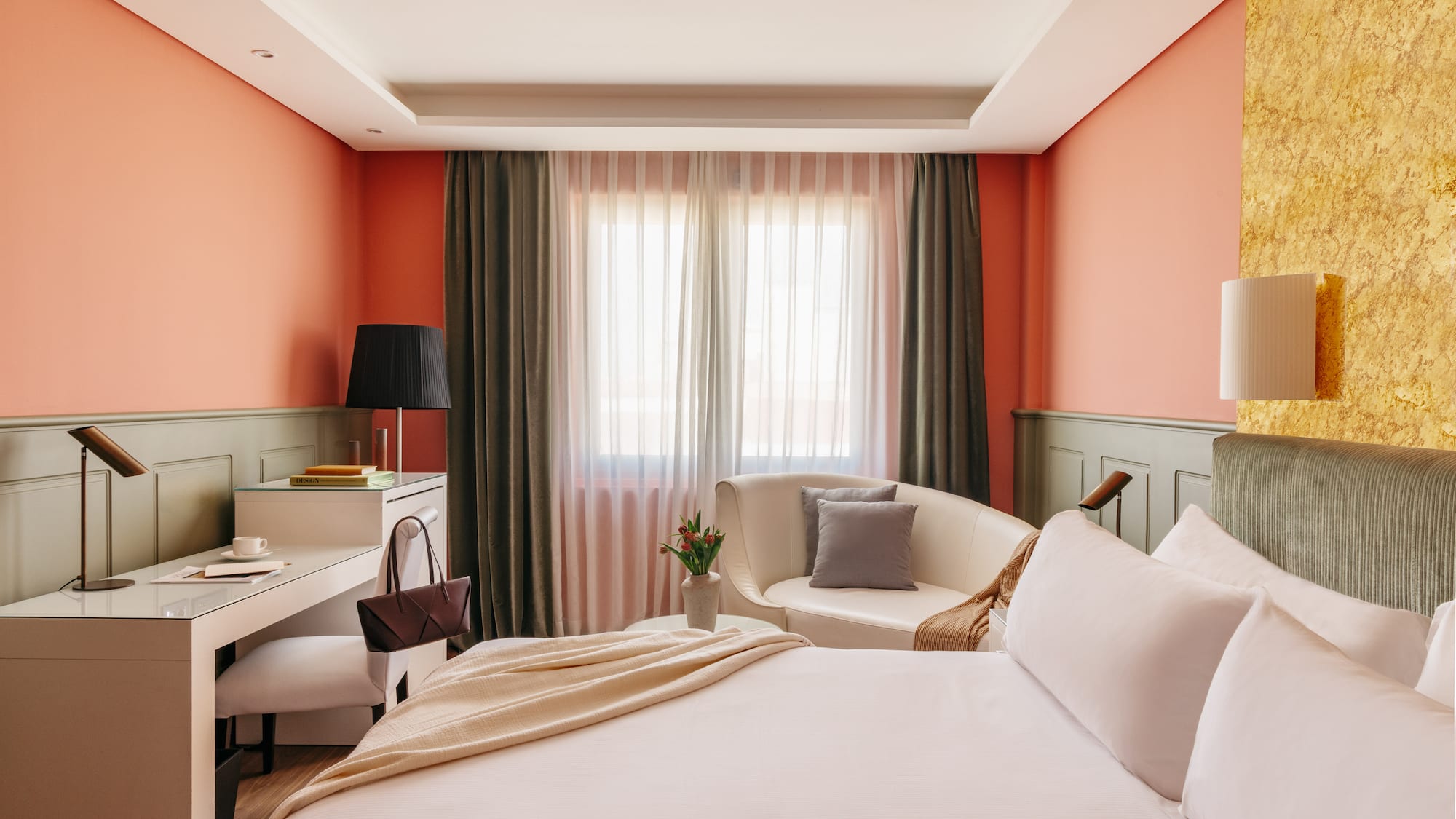 a bedroom with a bed and a chair