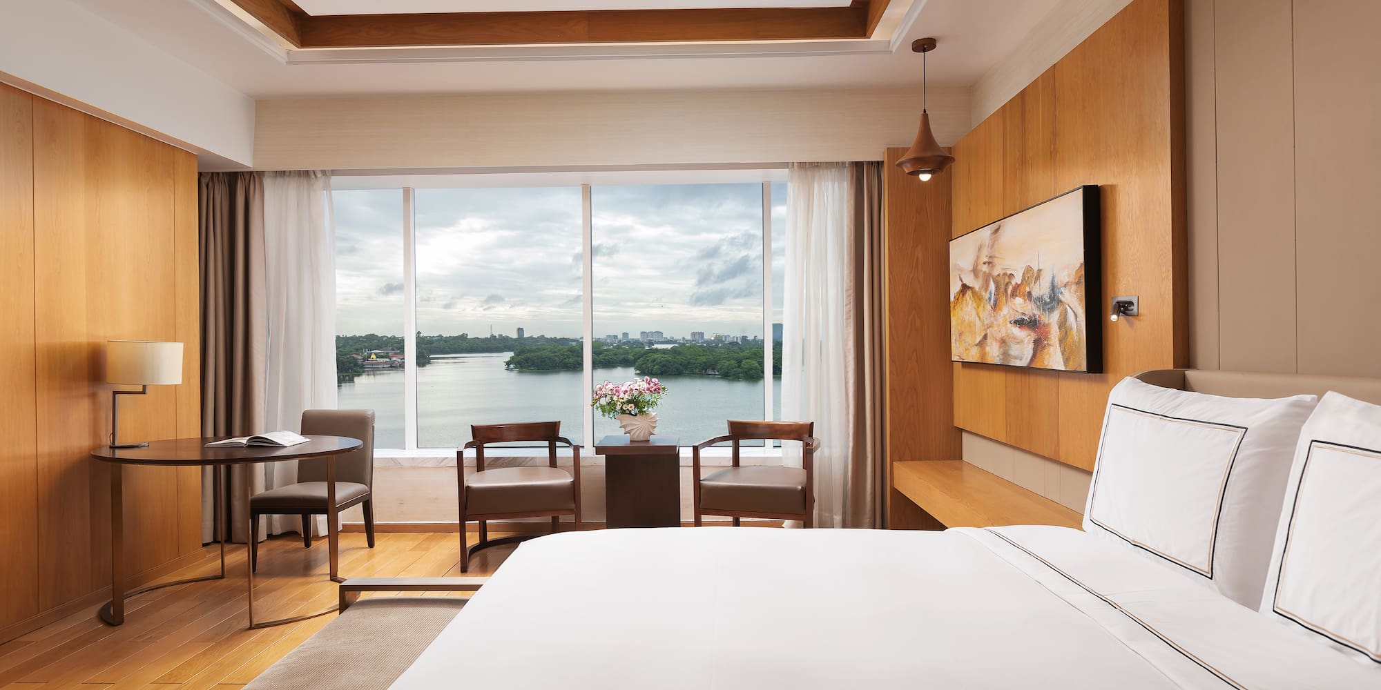 a room with a large window and a bed