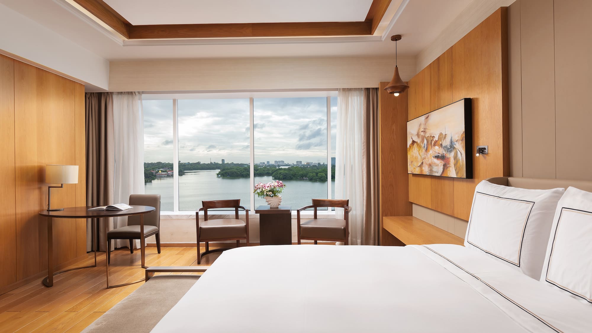 a room with a large window and a bed