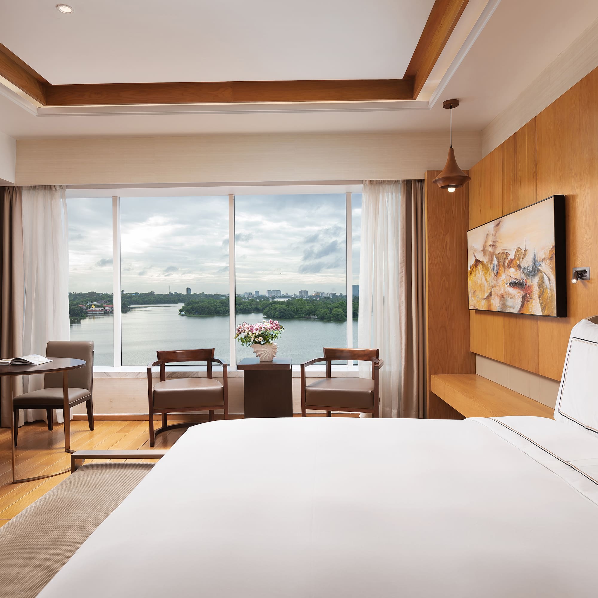 a room with a large window and a bed