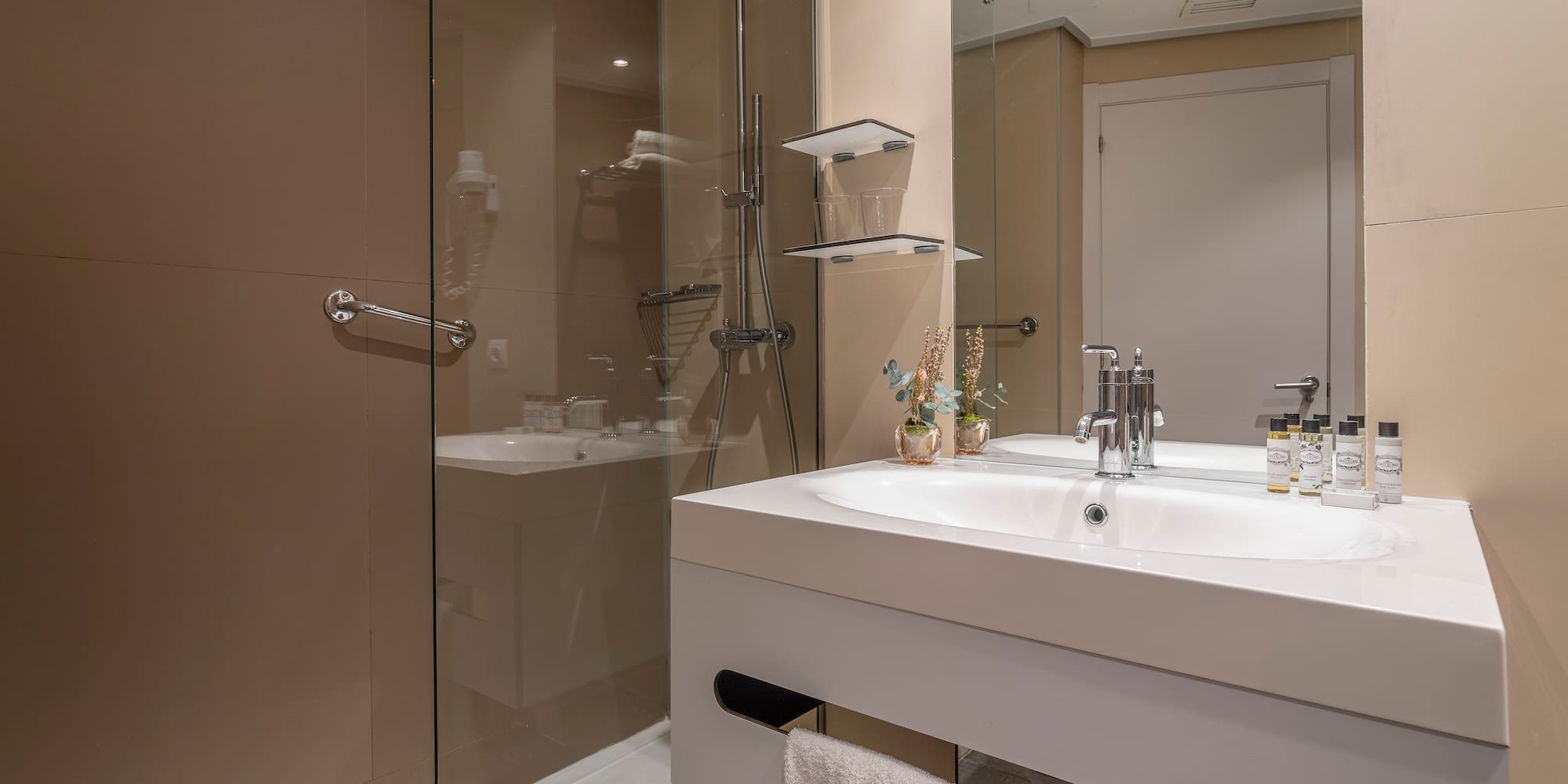 a bathroom with a shower and sink