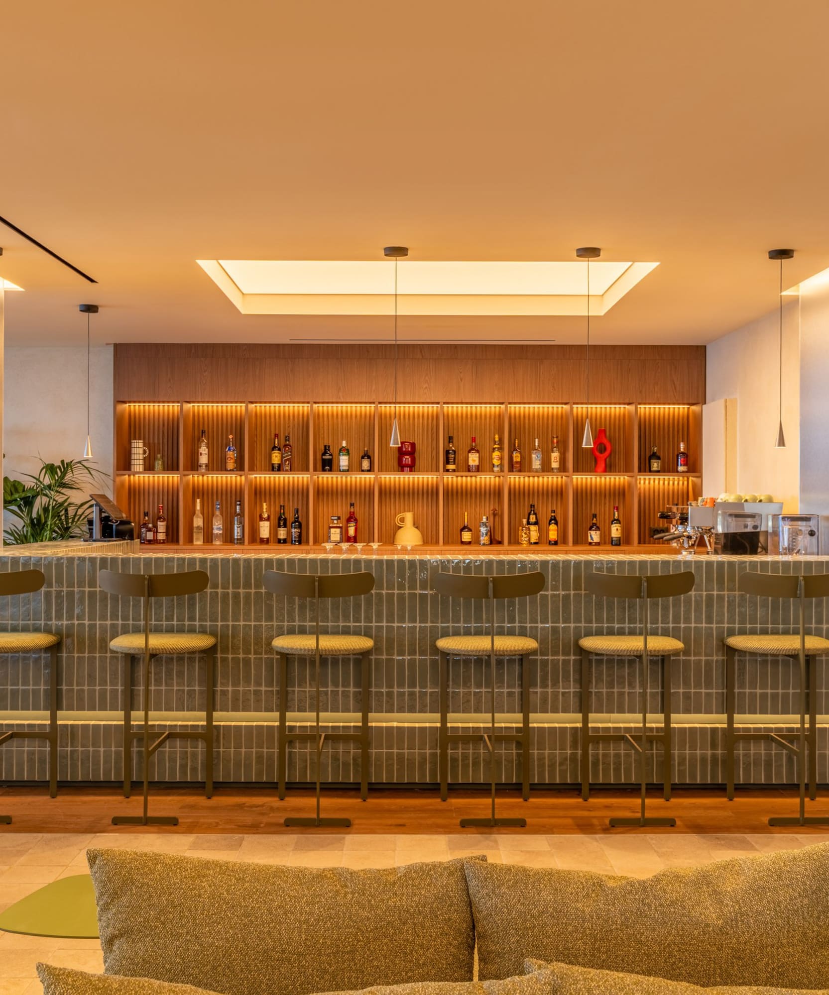 a bar with shelves and bottles of liquor