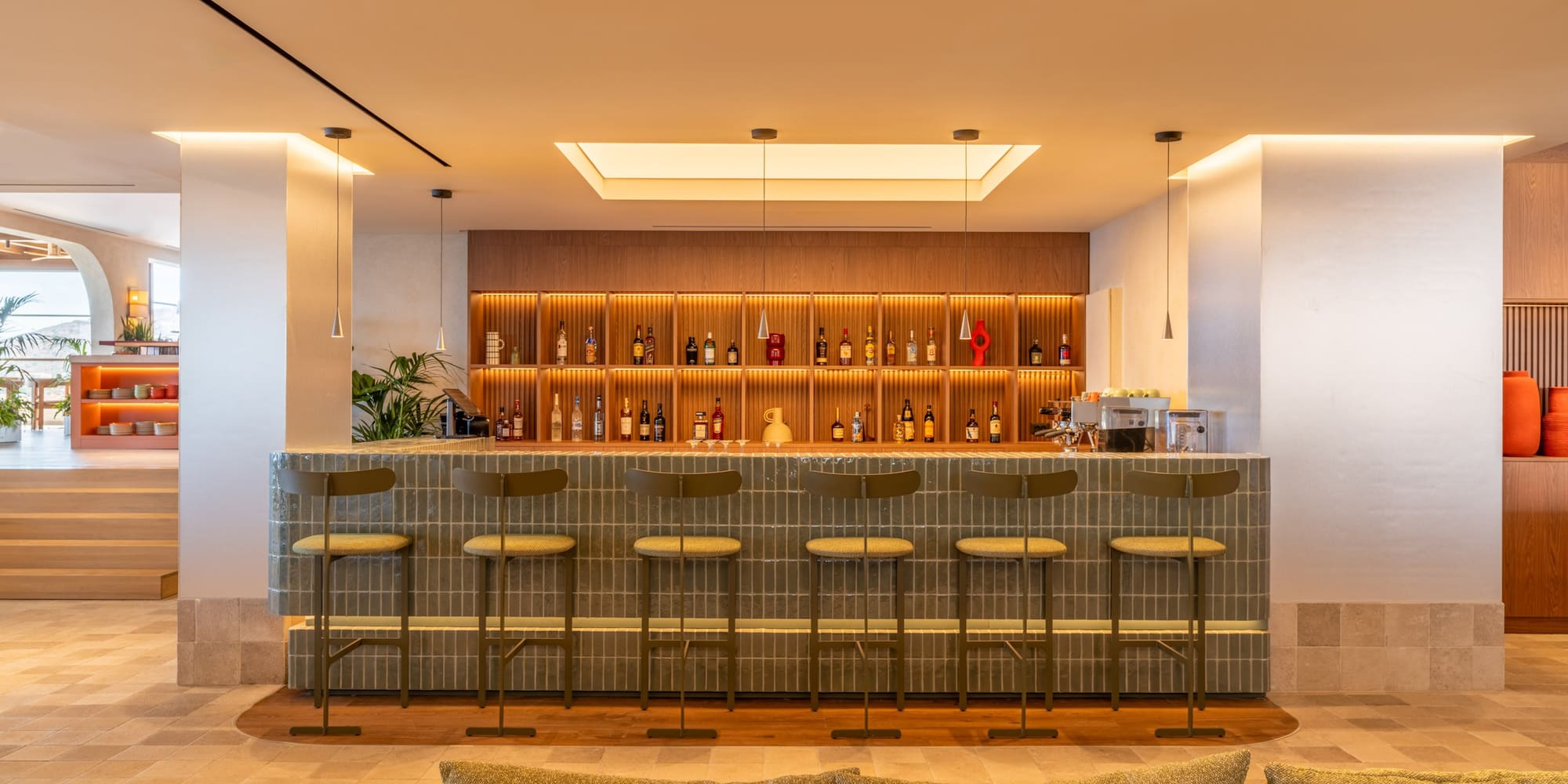a bar with shelves and bottles of liquor