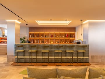 a bar with shelves and bottles of liquor