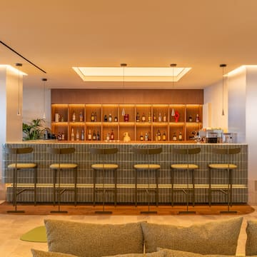 a bar with shelves and bottles of liquor