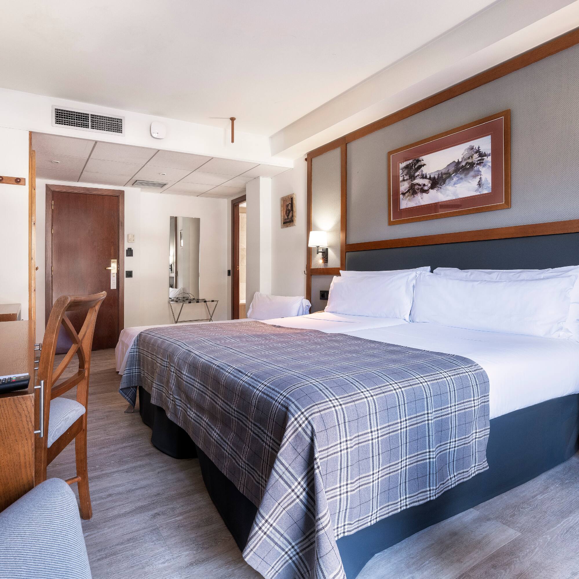 a bed in a hotel room