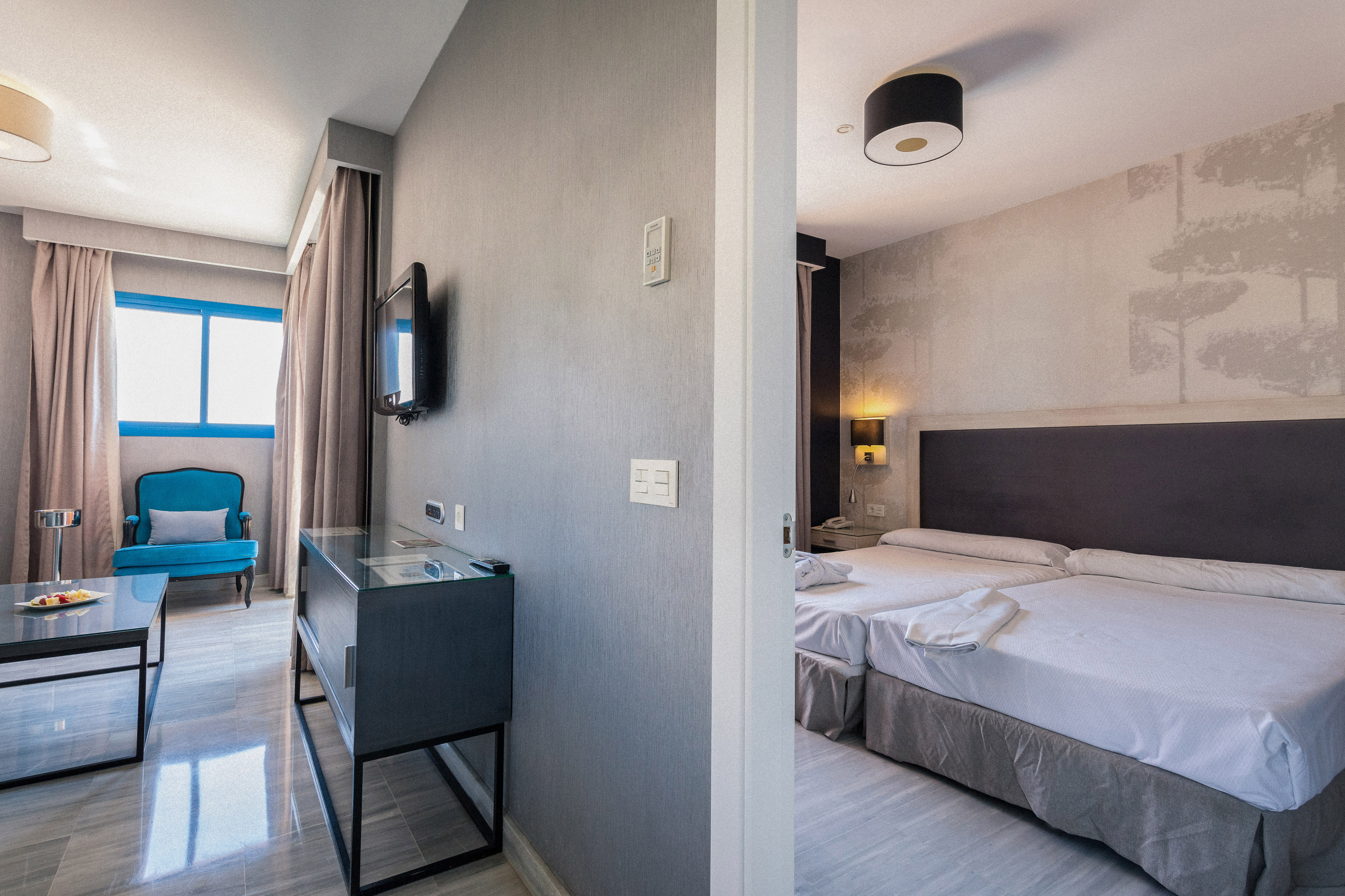 a room with a bed and a tv