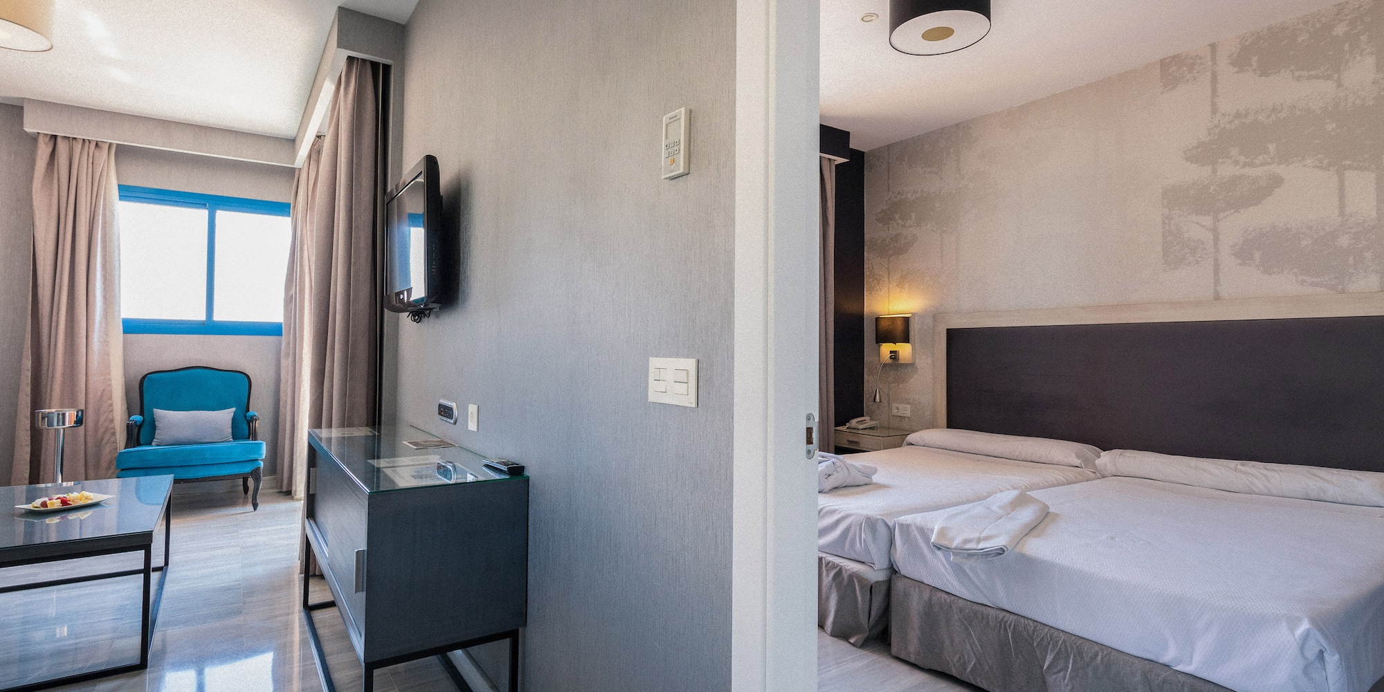 a room with a bed and a tv