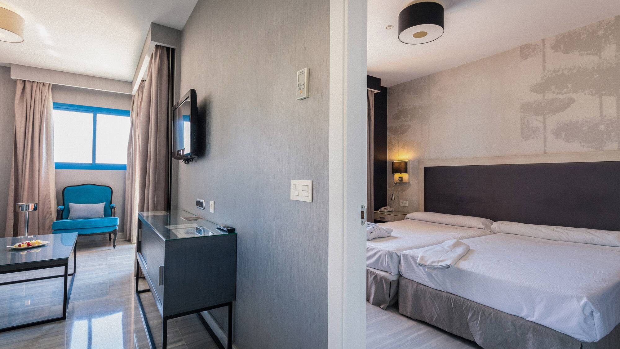 a room with a bed and a tv