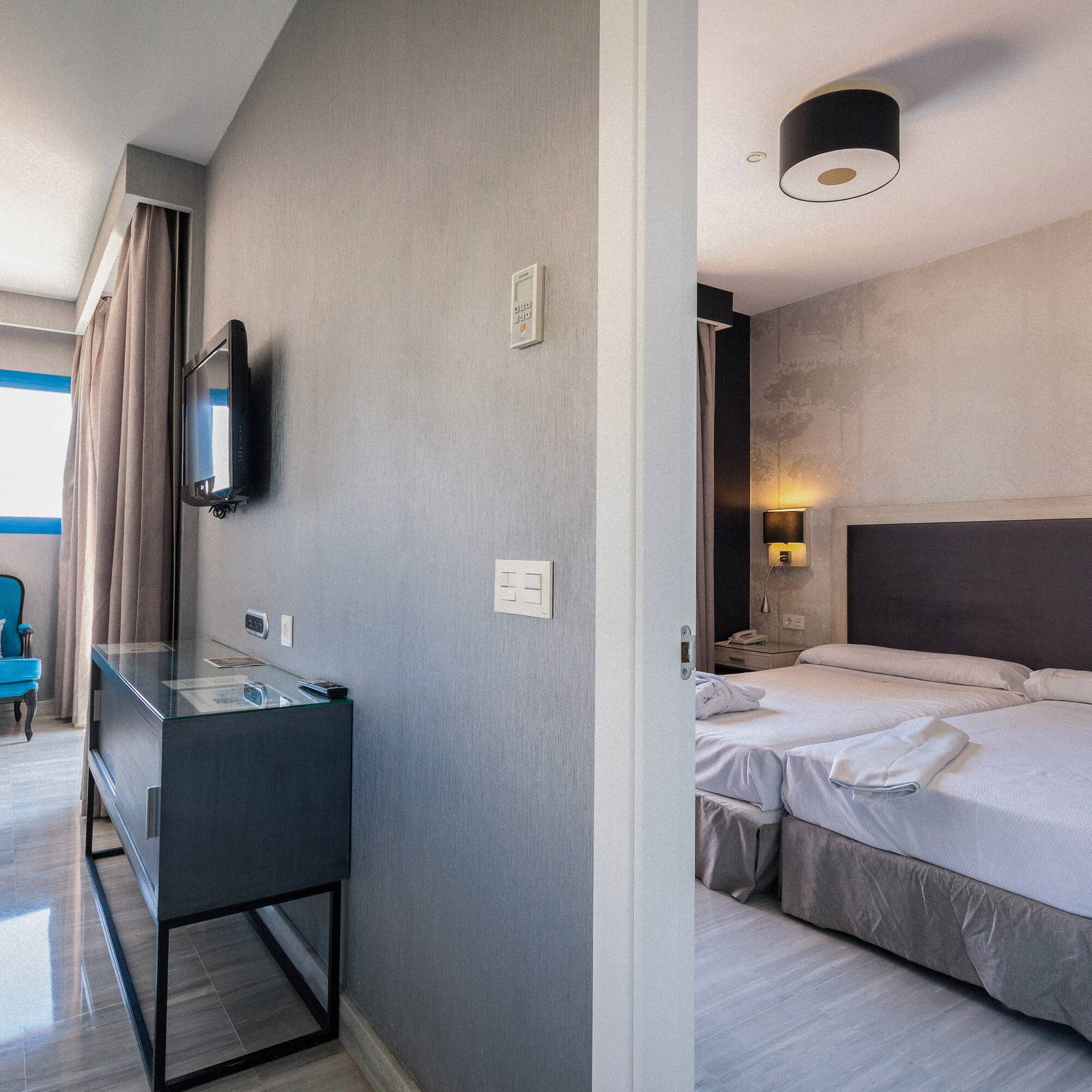 a room with a bed and a tv