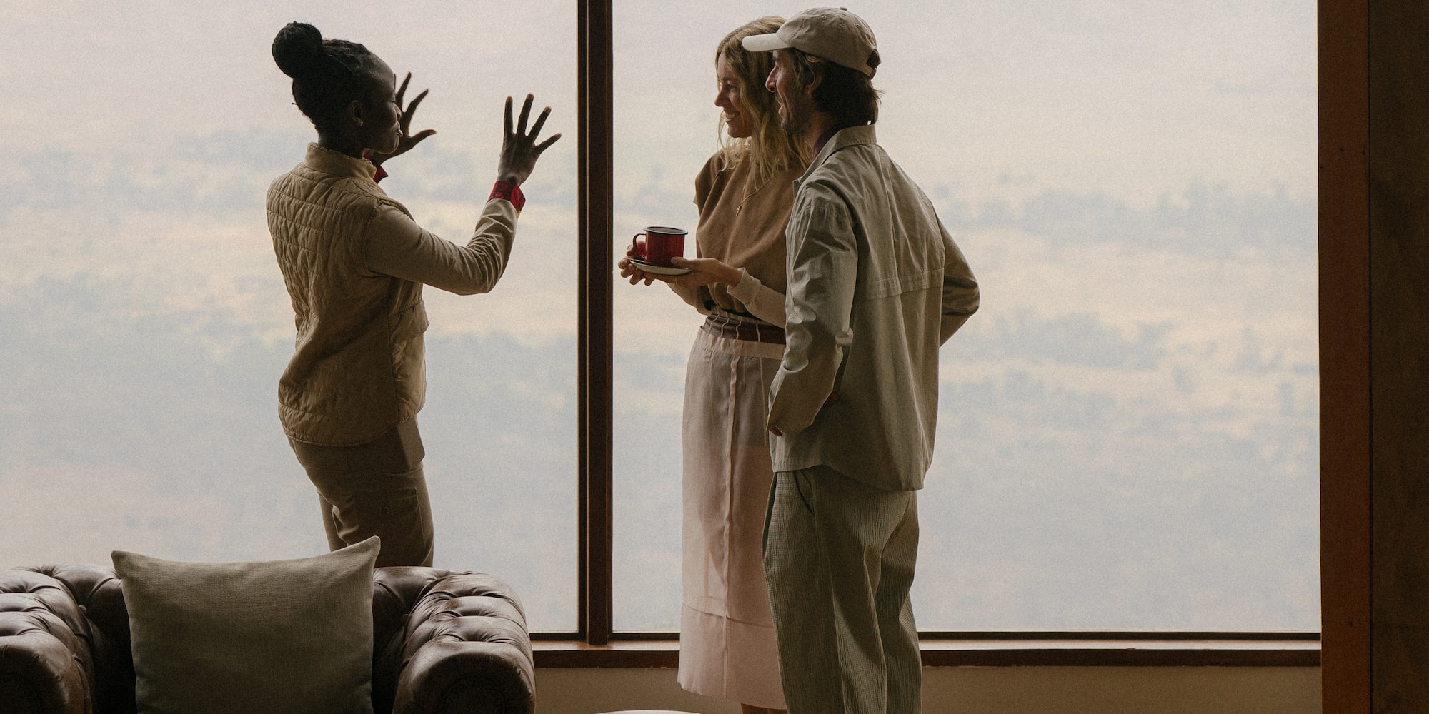 a group of people standing in front of a window