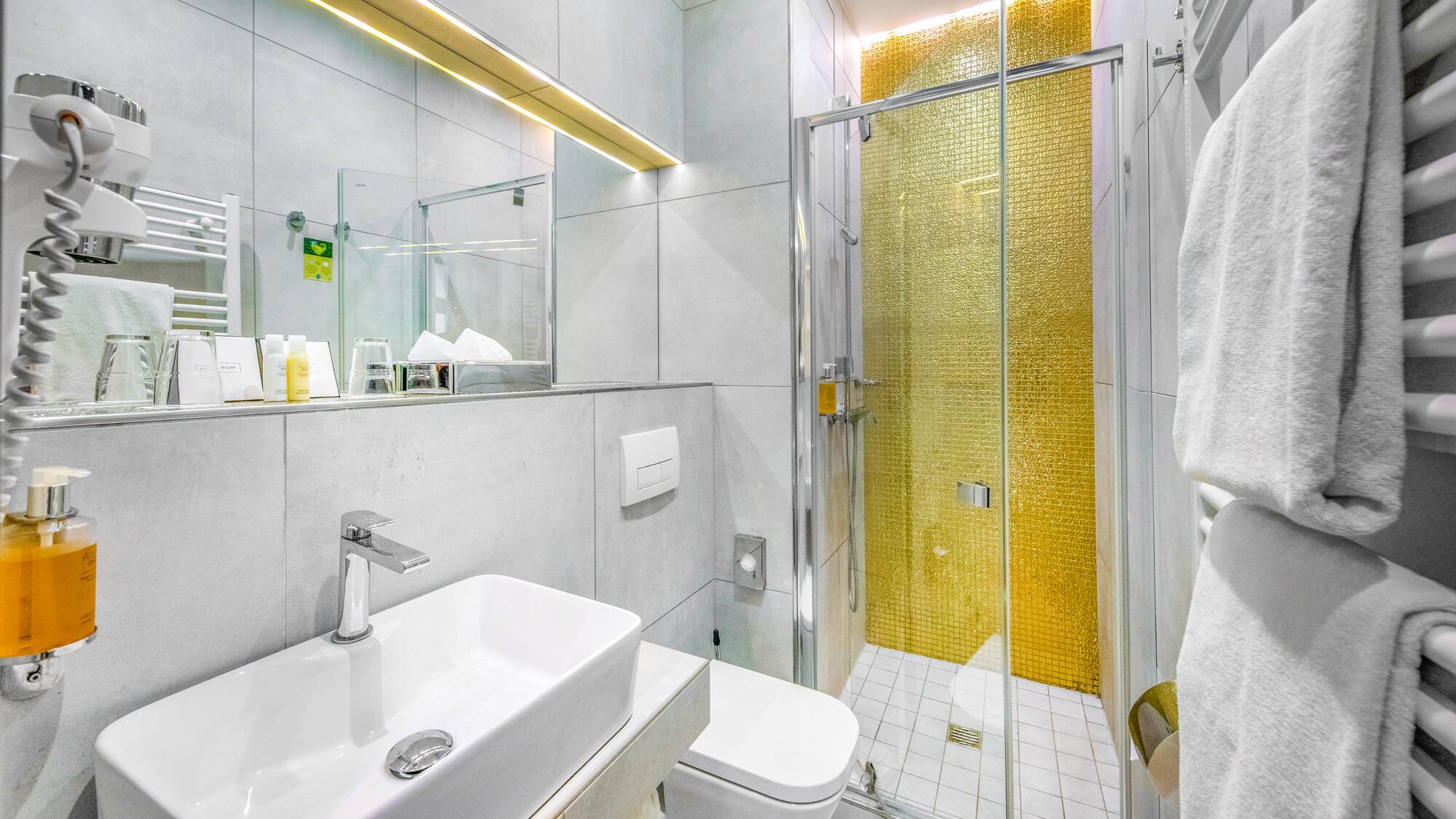 a bathroom with a shower and sink