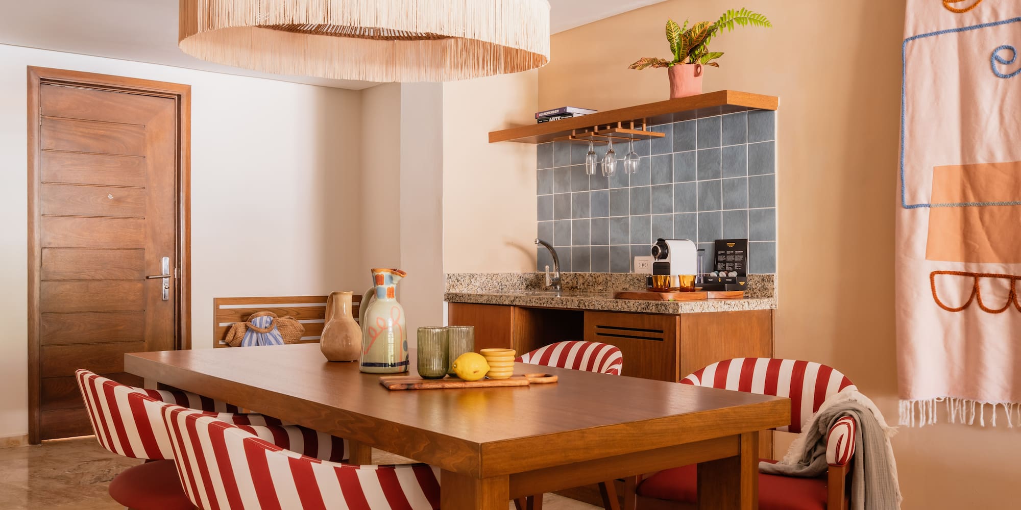 a dining table with chairs in a room