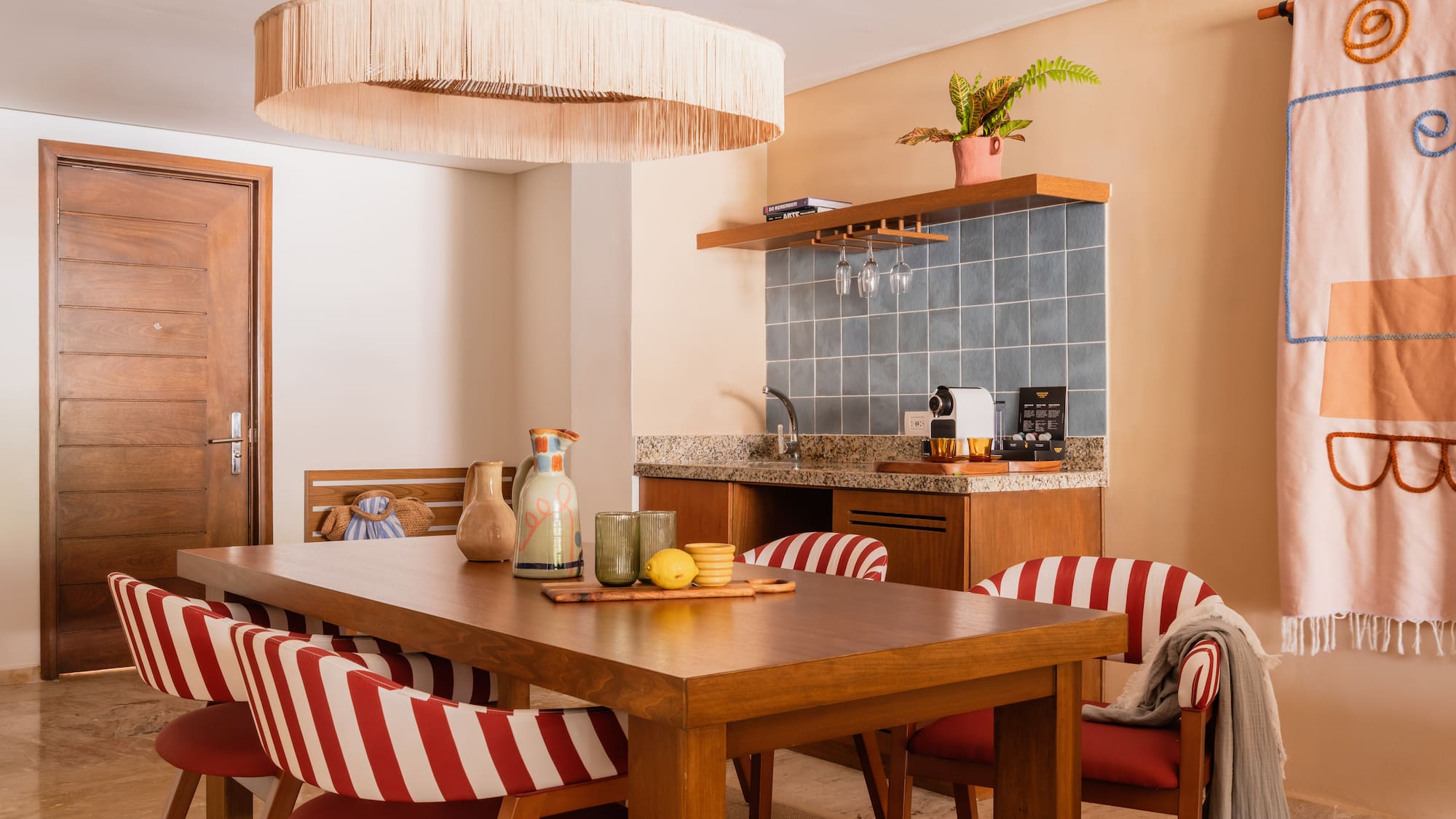 a dining table with chairs in a room