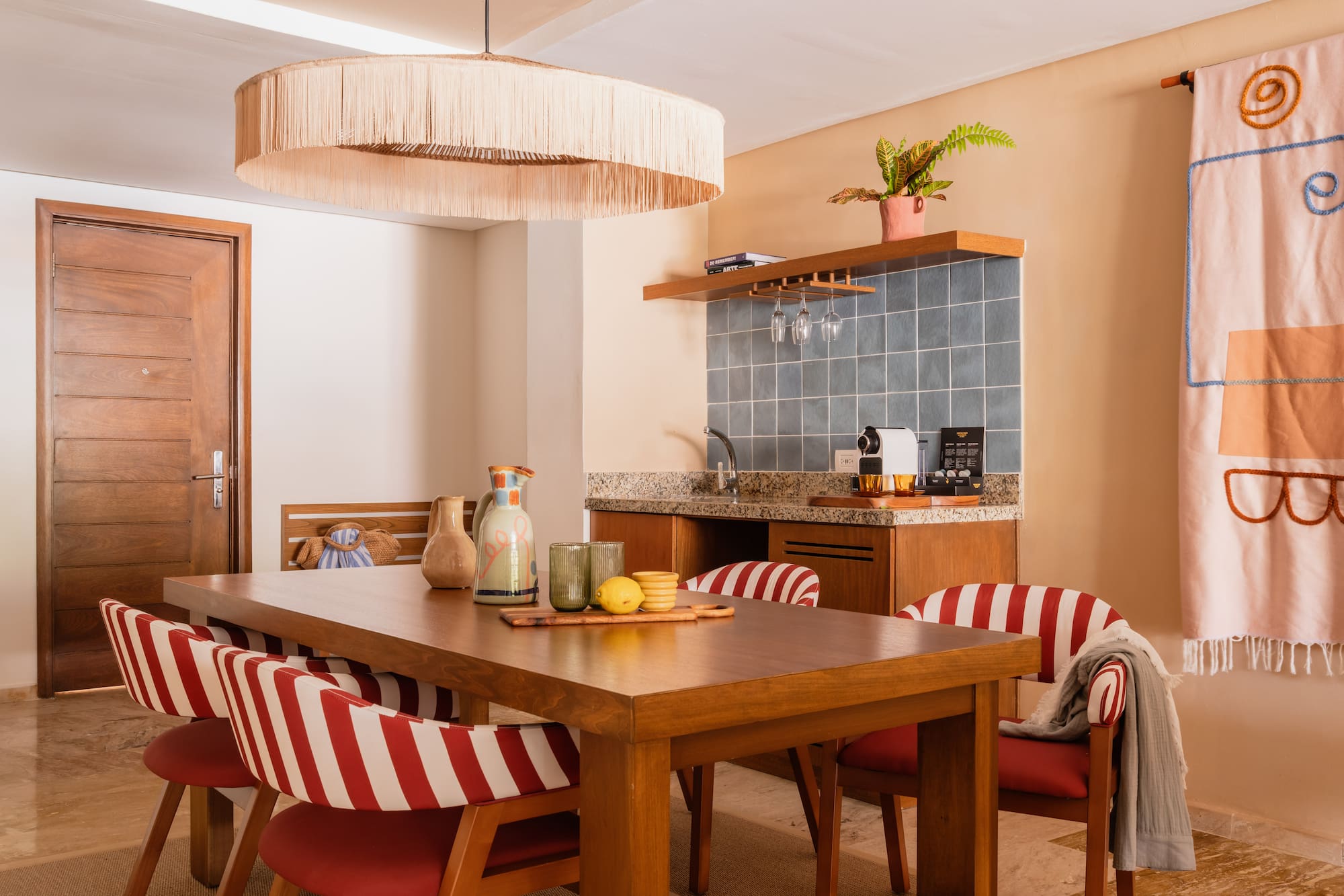 a dining table with chairs in a room