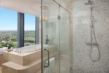 a bathroom with a bathtub and shower