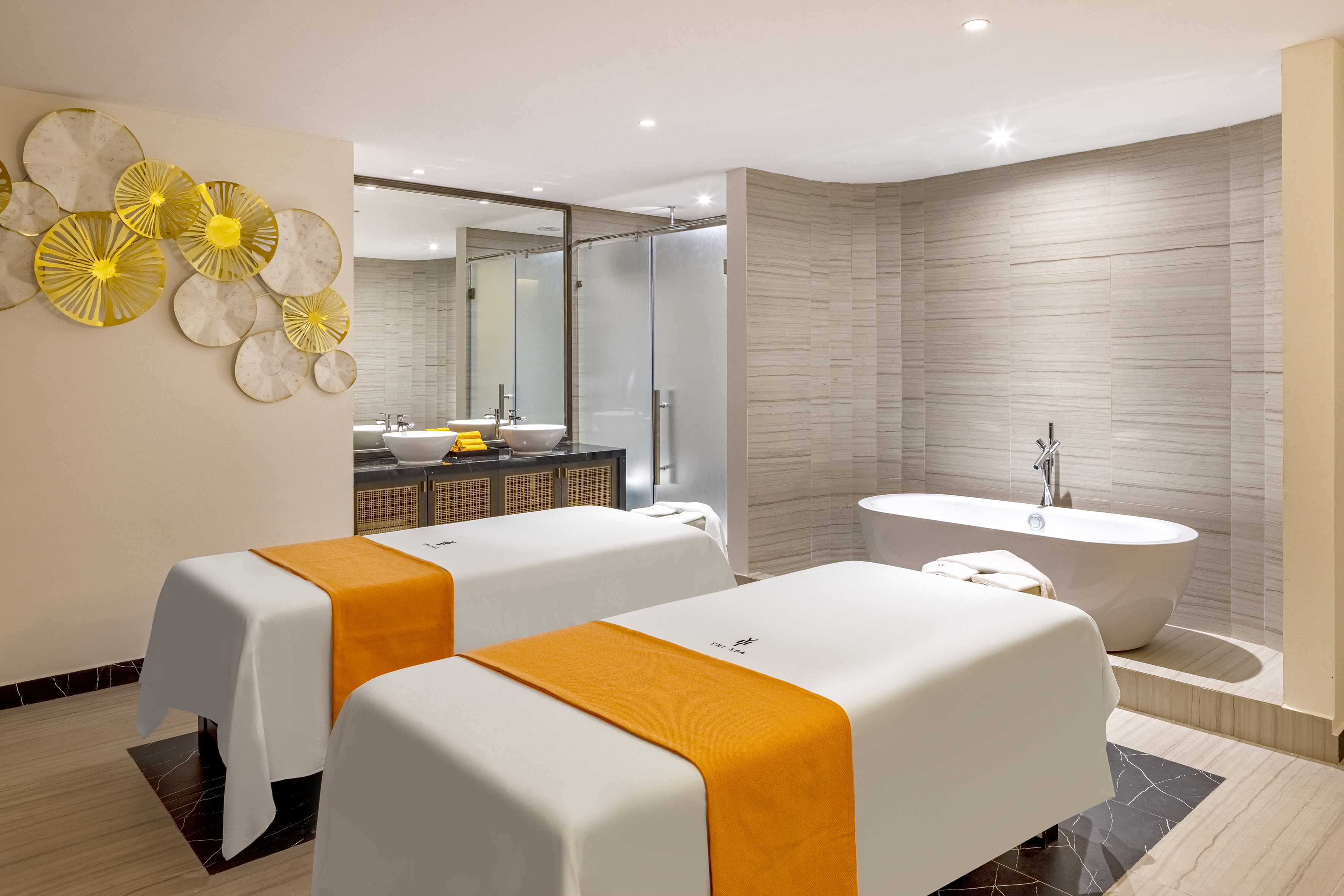 Private luxury spa room with two massage tables, freestanding bathtub, and shower. - YHI Spa - Meliá Vinpearl Thanh Hoa, Thanh Hoa