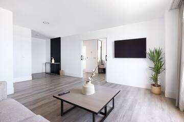 a living room with a tv and a table