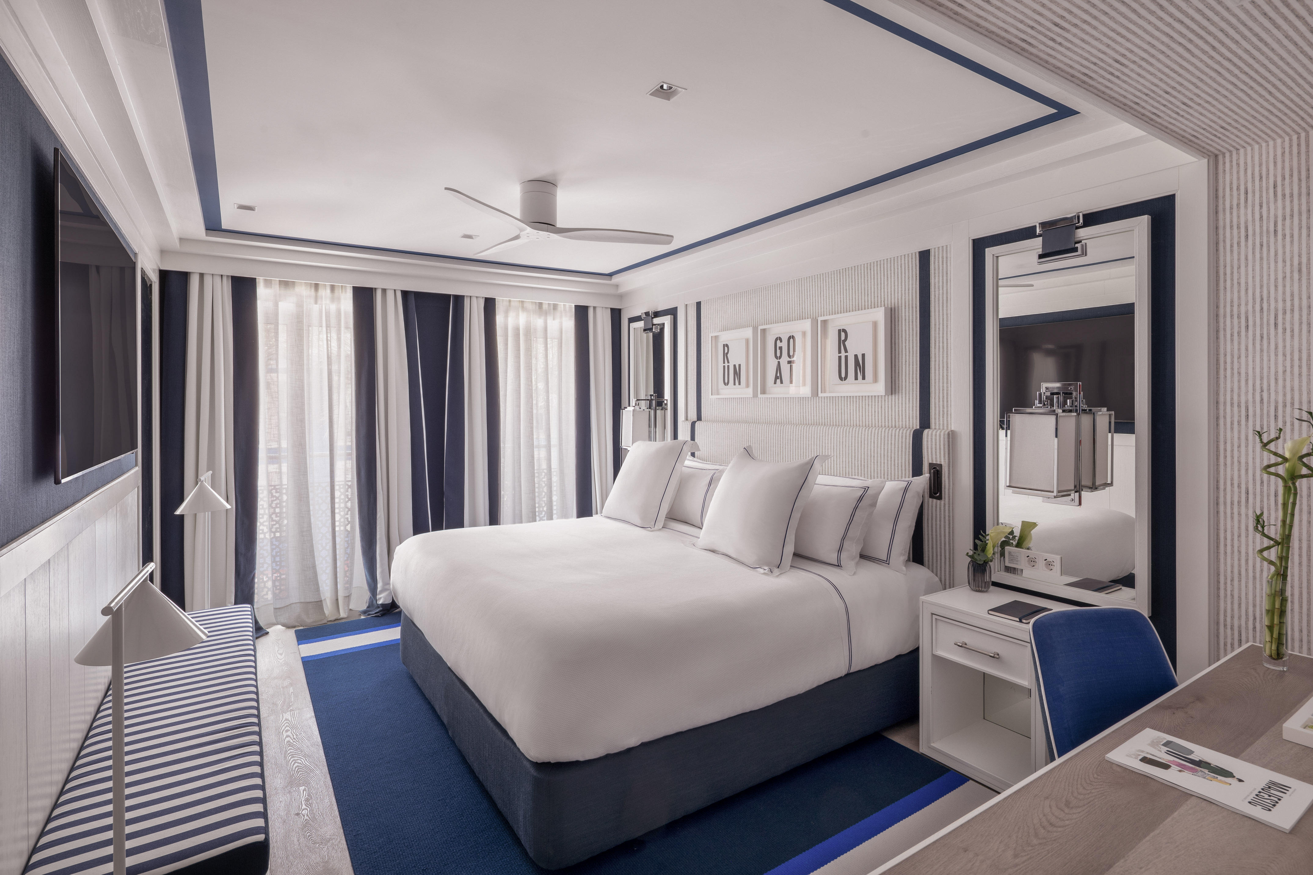 a room with a bed and a mirror