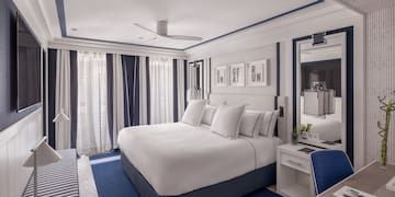 a room with a bed and a mirror