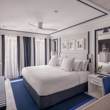 a room with a bed and a mirror