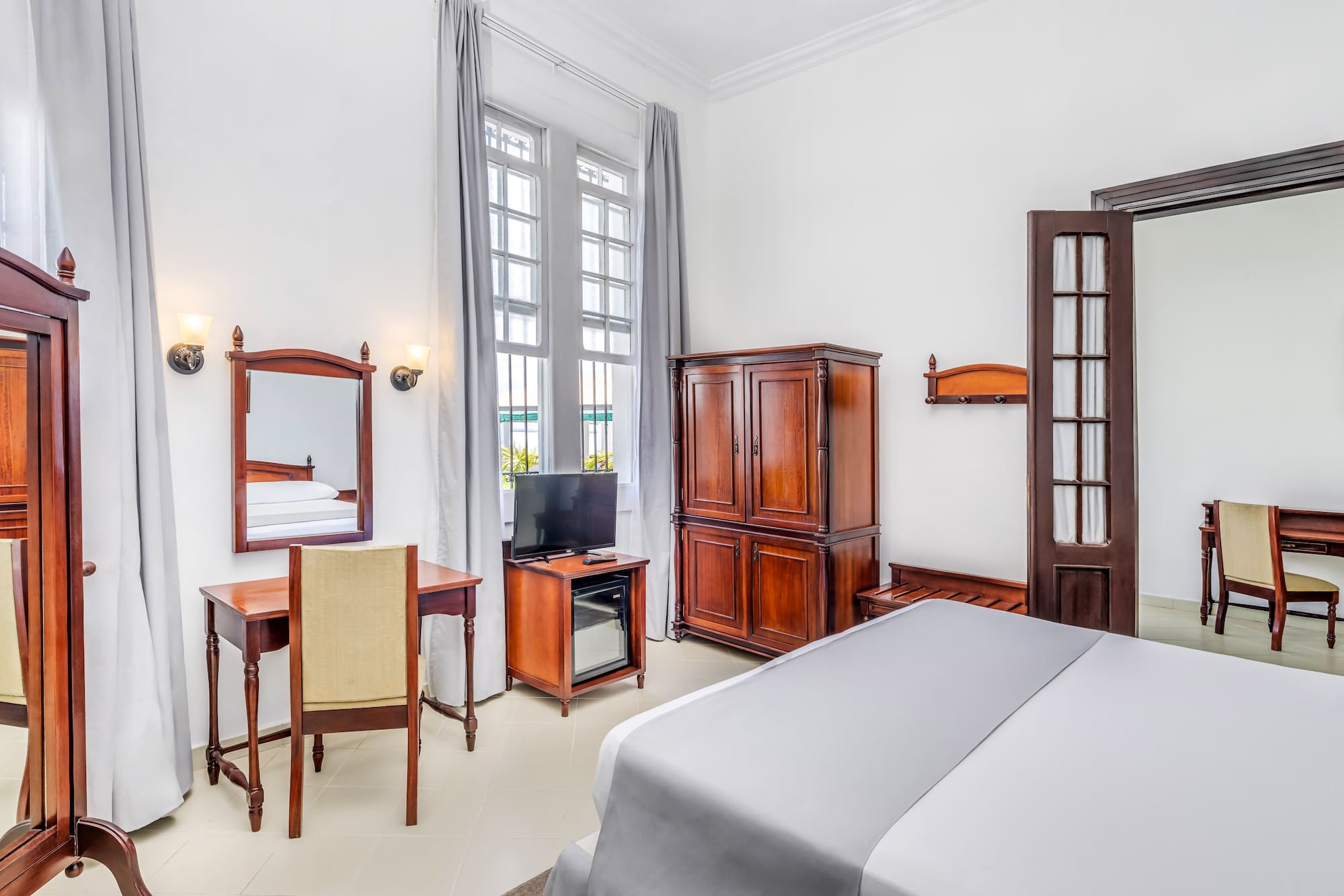 a room with a bed and a desk