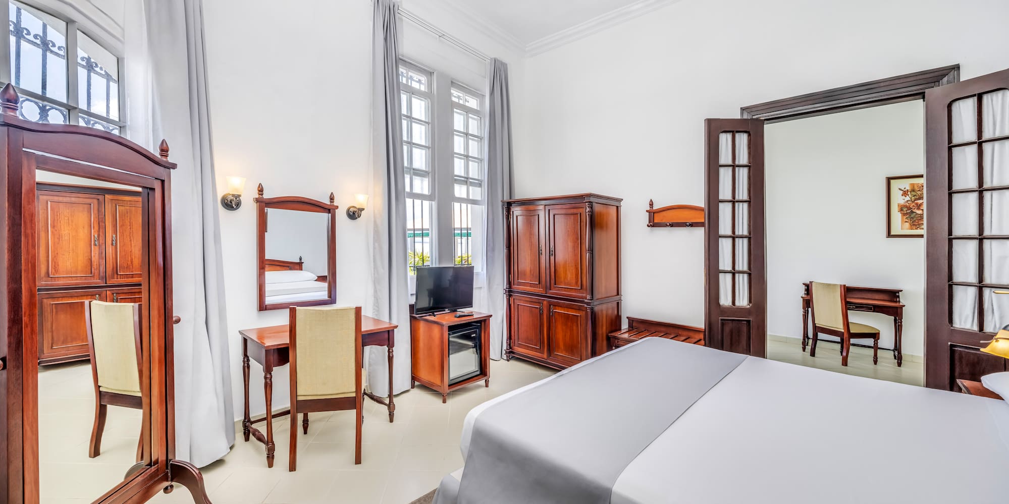 a room with a bed and a desk